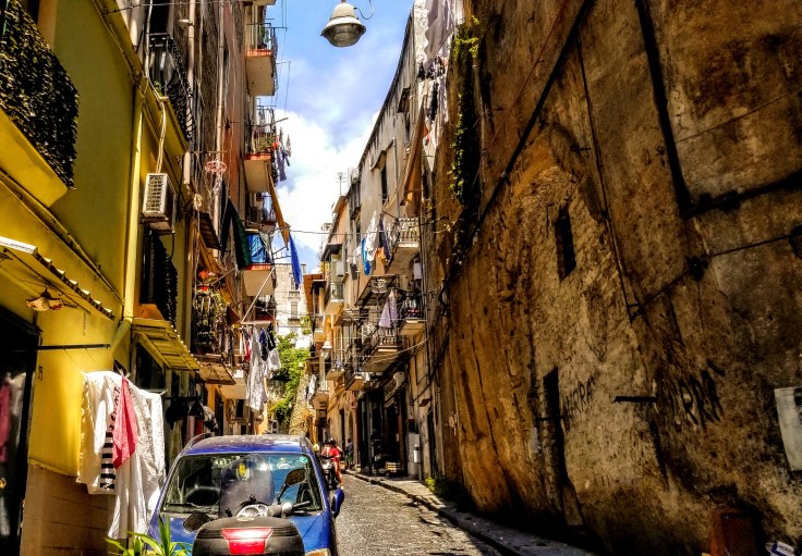 A narrow street in Naples, Italy.
