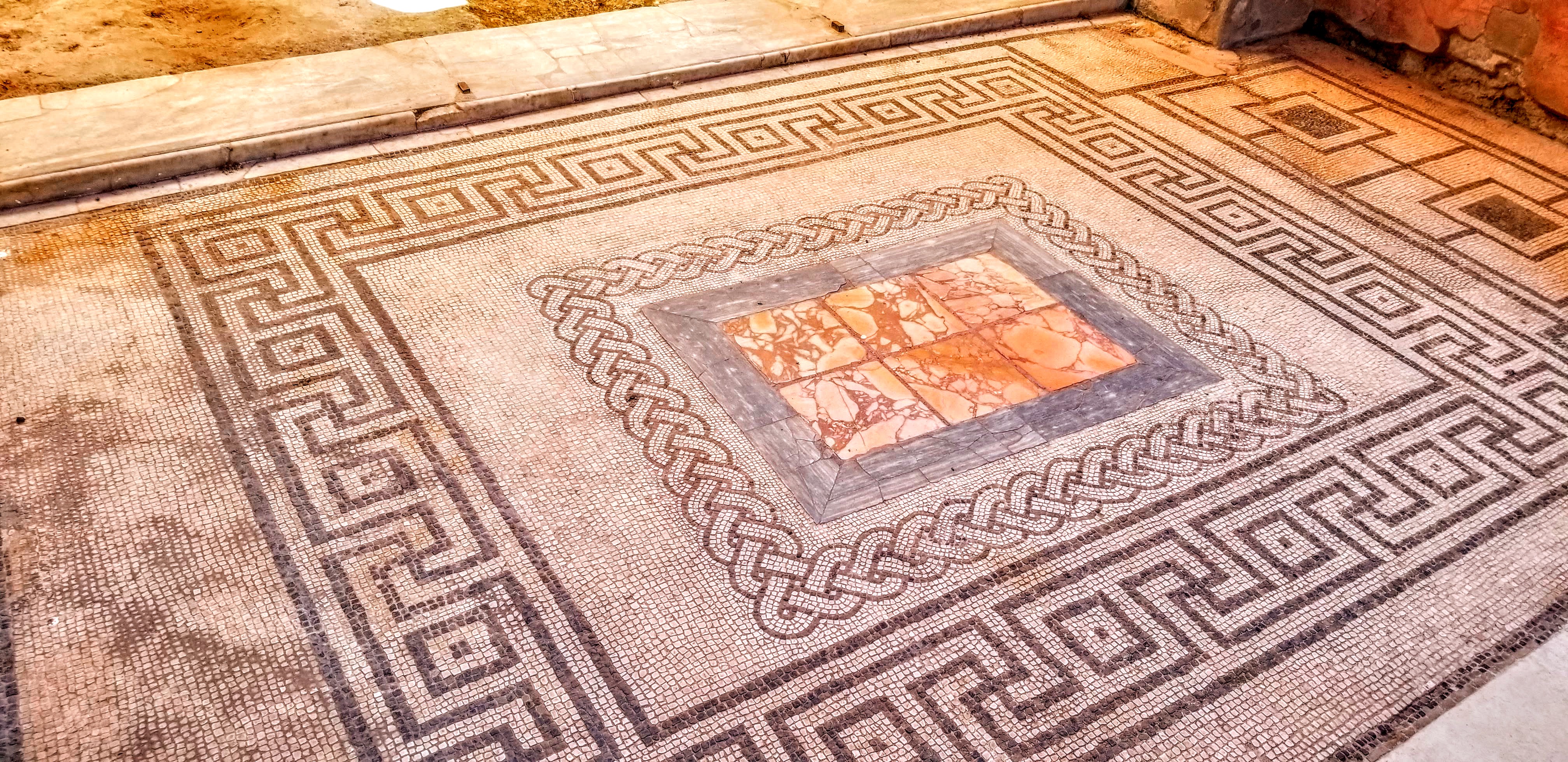An intricate floor mosaic in a house at Pompeii, Italy.