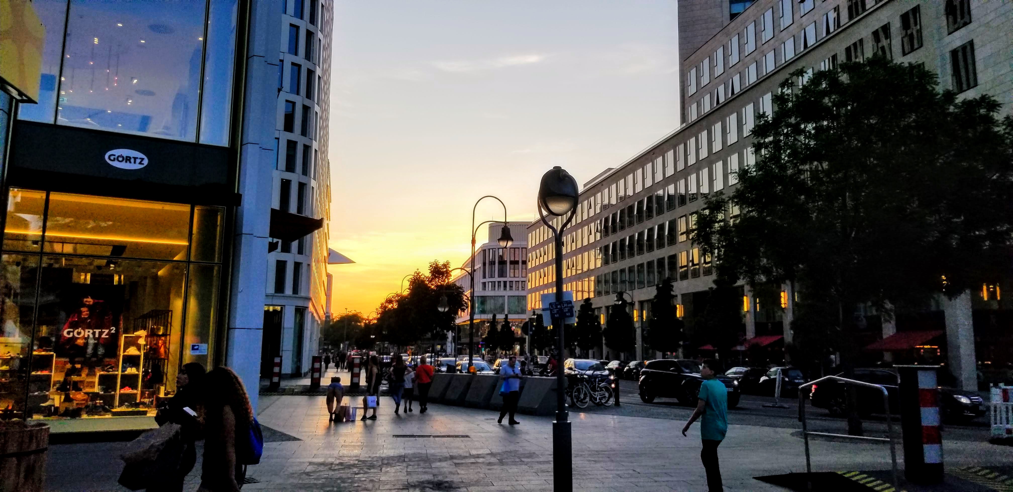 Sunset on a shopping street in Berlin, Germany.